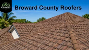 Broward County roofers installing a new residential roof on a modern Florida home under a clear blue sky.